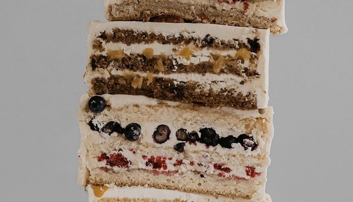 Closeup of the layers of several cakes.
